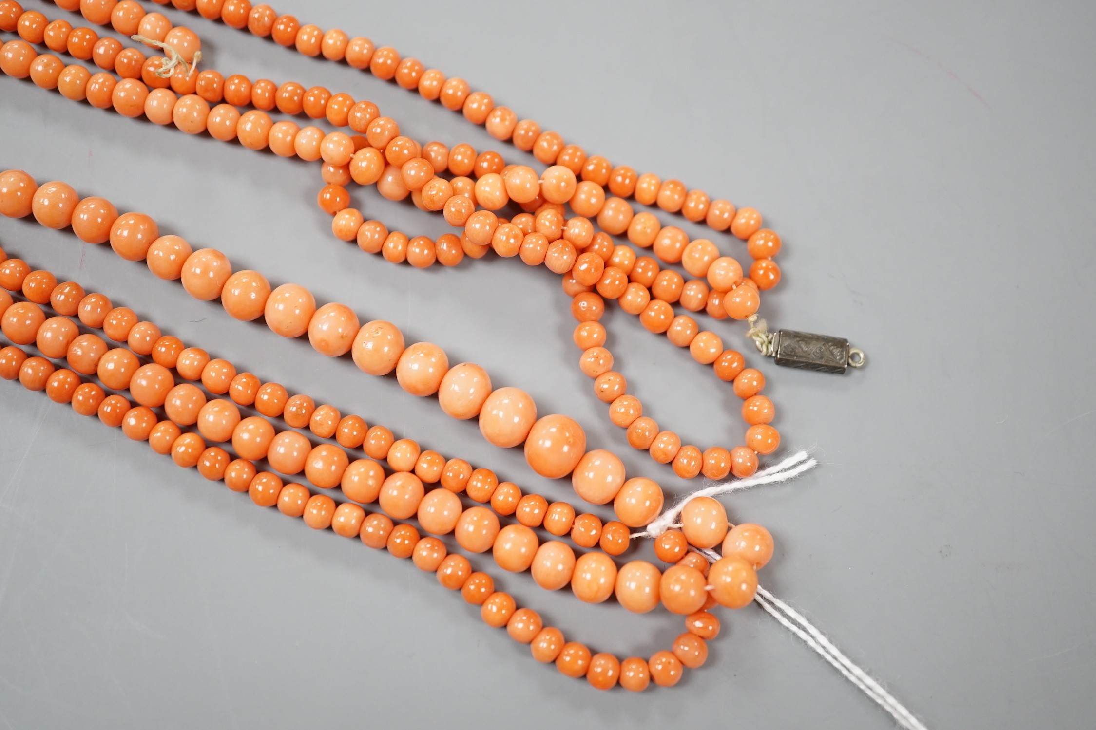 Two single strand coral bead necklaces, one a.f., longest 103cm.